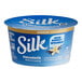 A blue round Silk Dairy-Free Vanilla Almond Milk Yogurt Alternative container with white text and a blue label.