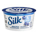 A Silk blueberry yogurt alternative container with blueberries on the label.