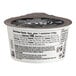 A So Delicious blueberry coconut milk yogurt cup with a black label.