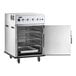 A stainless steel undercounter cook and hold smoker oven with multiple wire racks, control knobs, and a smoker box, shown with the door open.