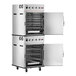 A stacked stainless steel cook and hold oven with smoker feature, featuring two compartments with open doors and multiple racks inside.