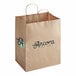 A natural kraft paper shopping bag with handles featuring the Ancora Cafe & Bakery logo.