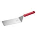 A close-up of a Choice red spatula with a handle.