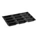 A black silicone baking tray with 12 oval-shaped compartments.
