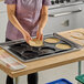 A person using a Sasa Demarle silicone round mold to make a pie.