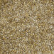 A close-up of a pile of crushed gold and brown grains.