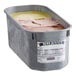 A white container of Bravo Spumoni Gelato with pink and yellow ice cream.