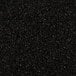 A close-up of a pile of crushed black malt.