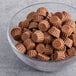 A bowl filled with REESE'S Mini Peanut Butter Cups.