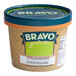 A white Bravo Strawberry Cheesecake Gelato cup.
