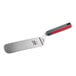 A stainless steel solid rounded edge turner with a red and gray nylon handle.