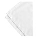 A folded white bed skirt on a white surface.