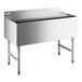 A Regency stainless steel underbar ice bin with sliding metal lid.
