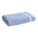 A blue and white 1888 Mills Fibertone pool/bath towel.