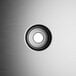 The black and white circular button with a black circle in the middle.