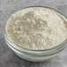 A bowl of Satin Ice Meringue Base powder.