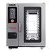A Vulcan Chef'sCombi electric combination oven with metal shelves.