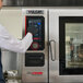 A Vulcan Chef'sCombi CHEF-102E-208 full size electric combi oven with a digital control panel and glass door.