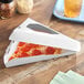 A Southern Champion white pizza slice box with a pizza inside.