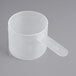 A clear plastic scoop with a short handle.