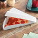A Southern Champion white paper box with a pizza slice inside.