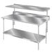 A stainless steel Advance Tabco splash mount shelf over a work table.