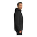 A man in a black Port Authority parka jacket with a hood.
