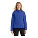 A woman wearing a Port Authority Core Soft Shell jacket in true royal blue.