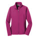 A pink Port Authority ladies soft shell jacket with a zipper.