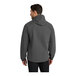 A man wearing a graphite Port Authority Essential Rain Jacket.
