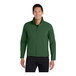 A man wearing a Port Authority forest green soft shell jacket.