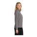 A close up of a Port Authority women's deep smoke soft shell jacket with black zippers.