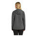 A woman wearing a graphite Port Authority Essential Rain Jacket.