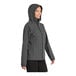 A woman wearing a graphite Port Authority rain jacket.