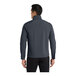 A man wearing a Port Authority Core Soft Shell Jacket in battleship gray.
