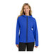 A woman wearing a blue Port Authority softshell rain jacket with a zipper.
