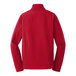A Port Authority red soft shell jacket with long sleeves.