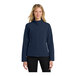 A woman wearing a Port Authority dress blue core soft shell jacket.