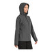 A woman wearing a graphite Port Authority Essential Rain Jacket.