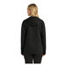 A woman wearing a black Port Authority Essential Rain Jacket.