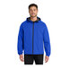 A man wearing a bright blue Port Authority rain jacket with black trim.