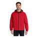 A man wearing a Port Authority red rain jacket.