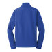 A close-up of a Port Authority blue men's soft shell jacket.