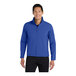 A man wearing a Port Authority Core Soft Shell jacket in true royal blue.