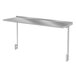An Advance Tabco stainless steel rectangular shelf with a metal frame mounted to a table.