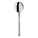 A close-up of a silver spoon with a long handle.