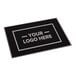 A rectangular black entrance mat with a customizable logo area, designed for indoor or outdoor use.