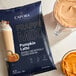 A 3.5 lb. bag of Capora Pumpkin Latte Frappe Mix, a naturally and artificially flavored drink mix.