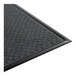 A rectangular black anti-fatigue entrance mat with a textured surface and beveled edges.