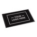 A rectangular black entrance mat with customizable logo space, designed for indoor or outdoor use.